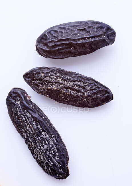 Black beans on white background — Stock Photo
