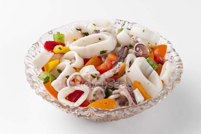 Close-up shot of delicious Calamari salad with peppers — Stock Photo