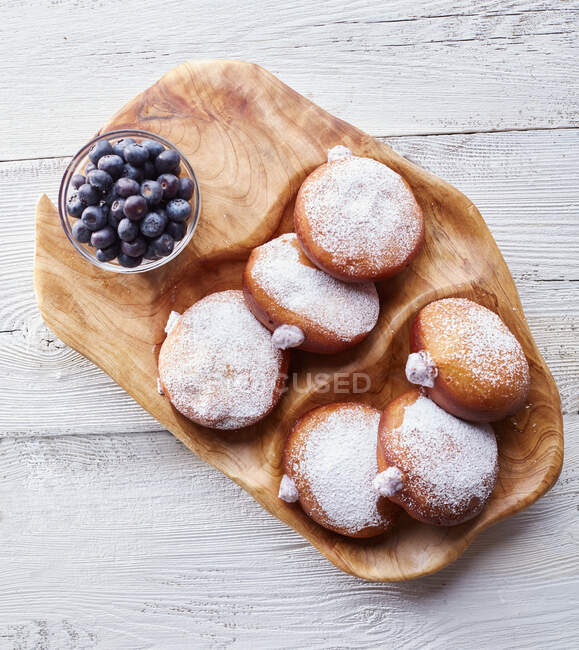 Chevre Filled Doughnuts On Wood — Stock Photo