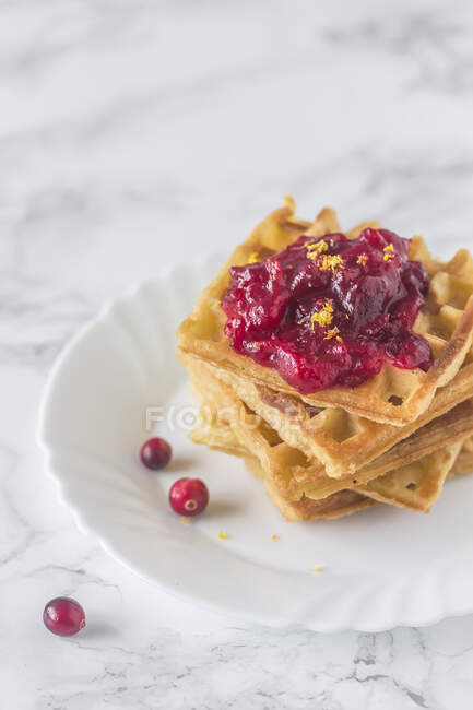 Stack of waffles with cranberry jam — Stock Photo