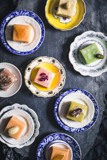 Various marzipan sweets on plates (Patisserie Fruth, Vienna) — Stock Photo