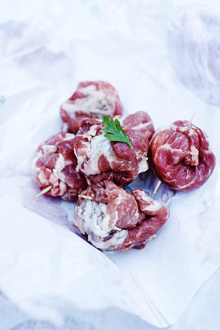 Raw 'La Bombetta Pugliese' (marbled pork shoulder filled with cheese, Italy) — Stock Photo