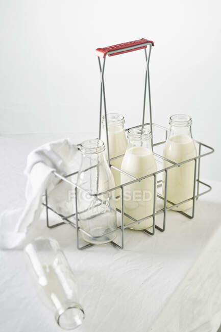 Milk in a rack — Stock Photo