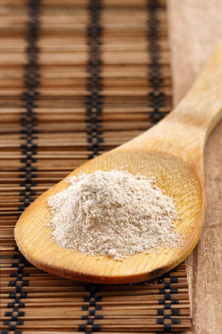 Tsampa flour on a wooden spoon (Tibet) — Stock Photo
