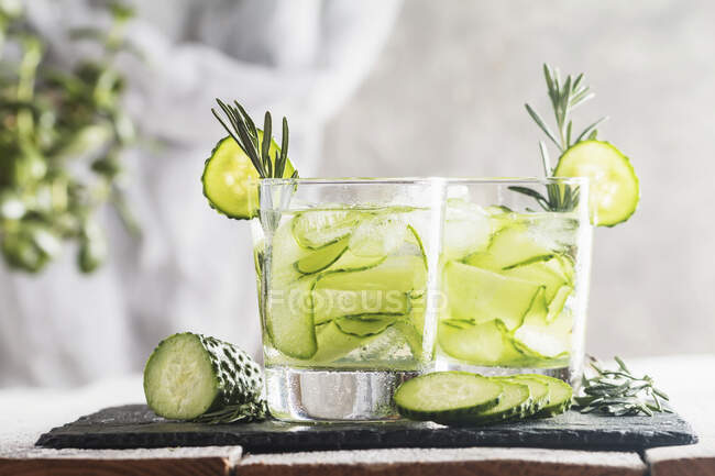Glasses with fresh organic detox cucumber water — Stock Photo