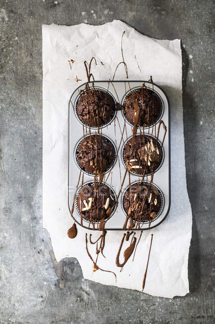 Close-up shot of Chocolate muffins in a muffin tin — Stock Photo