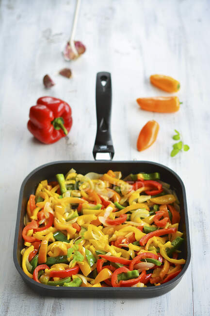 Colourful peppers in a pan — Stock Photo