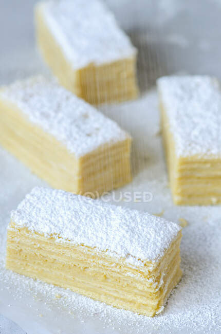 Puff pastry slices sprinkled with icing sugar — Stock Photo