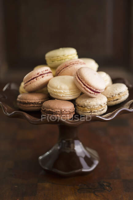Various french macarons on cake stand — Stock Photo