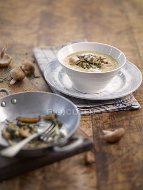 Wild mushroom soup on table — Stock Photo