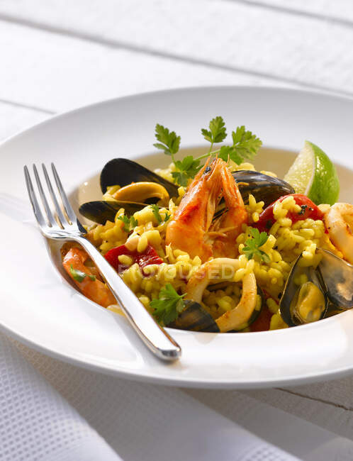Seafood risotto with lime — Stock Photo