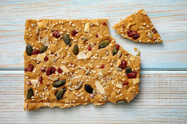 Close-up shot of delicious Crispbread with coconut and cranberries — Stock Photo