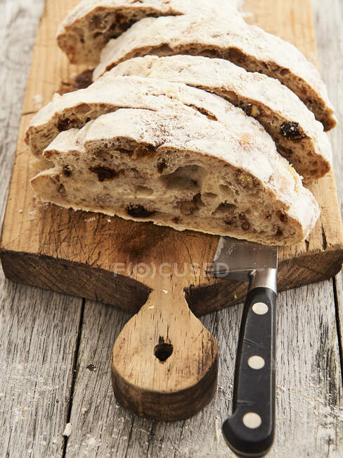 Tomato bread on wooden chopping board — Stock Photo