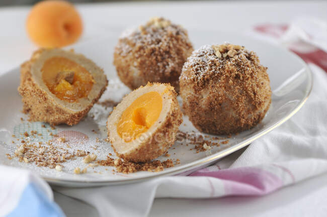 Apricot dumplings wrapped in crunchy hazelnut crumbs (vegan) — Stock Photo