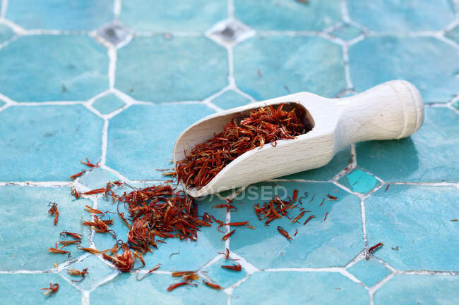 Saffron from Bali on a wooden scoop — Stock Photo