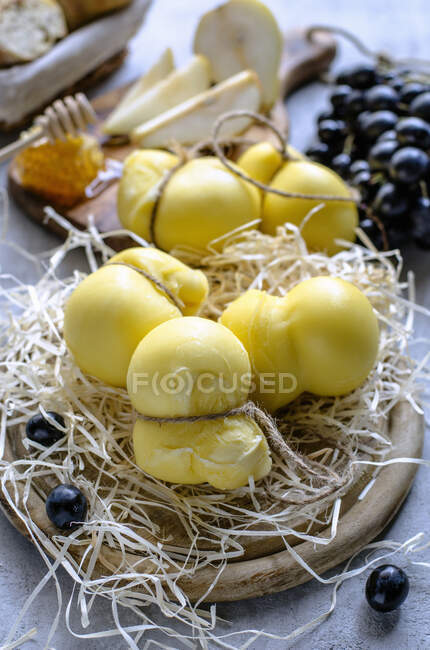 Aged mozzarella cheese and different appetizers for wine - foto de stock