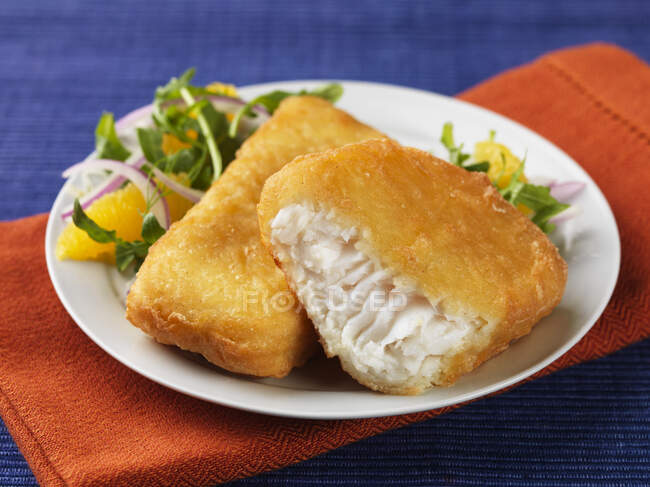 Halibut in batter with a salad side dish — Stock Photo