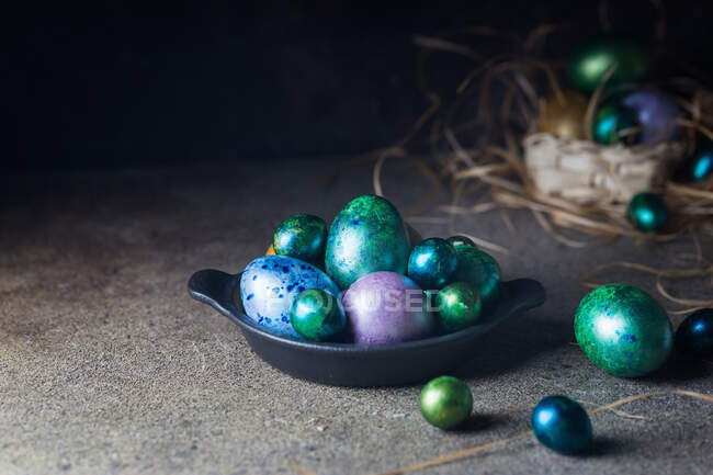 Easter background with painted Easter eggs in vintage style over dark background — Stock Photo