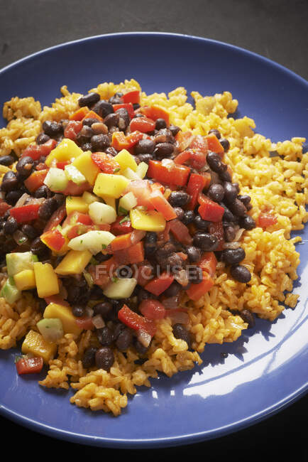 Annatto rice with beans and peppers, close up shot — Stock Photo