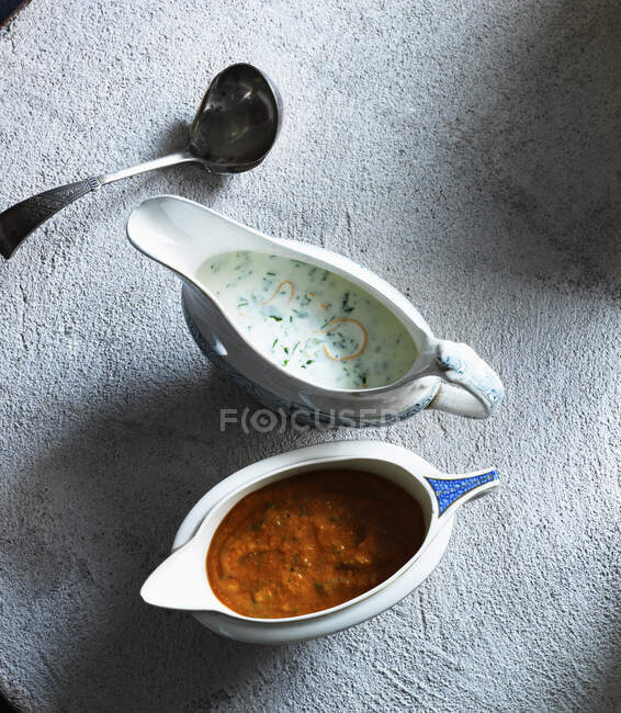 Soup with vegetables and spices on a wooden background — Stock Photo
