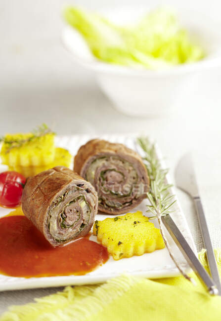 Italian beef roulade with polenta and tomato sauce — Stock Photo