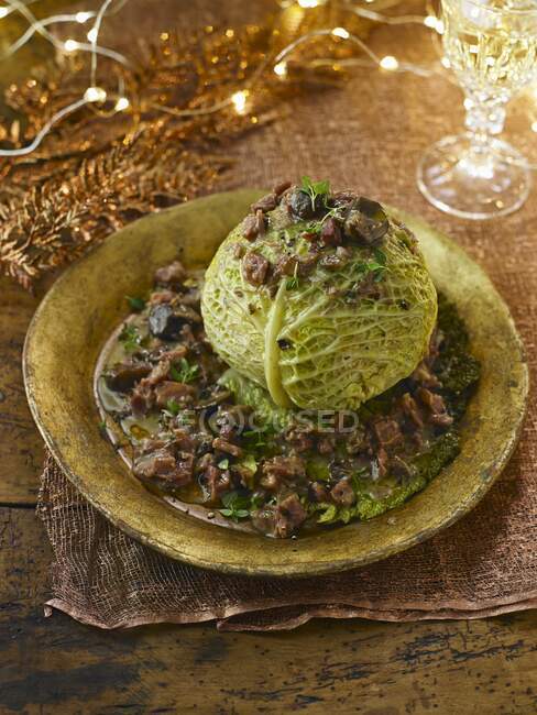 A braised savoy cabbage head garnished for Christmas — Stock Photo