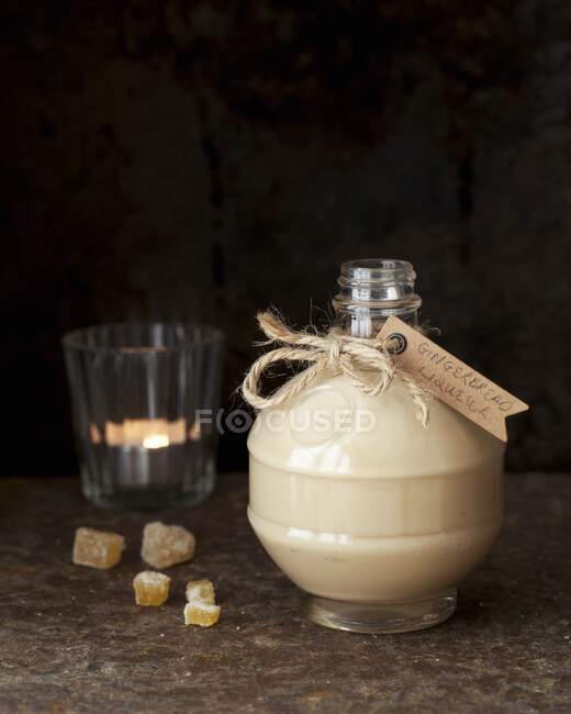 Homemade gingerbread liqueur in a decorative bottle for gifting — Stock Photo