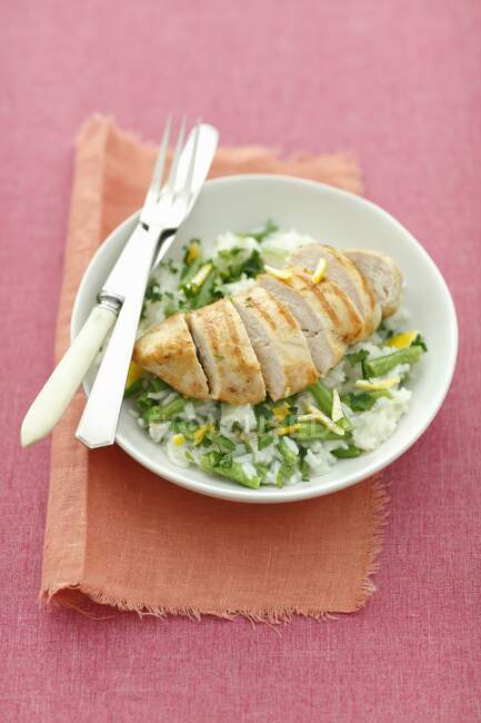 Grilled chicken breast with lemon rice and green beans — Stock Photo