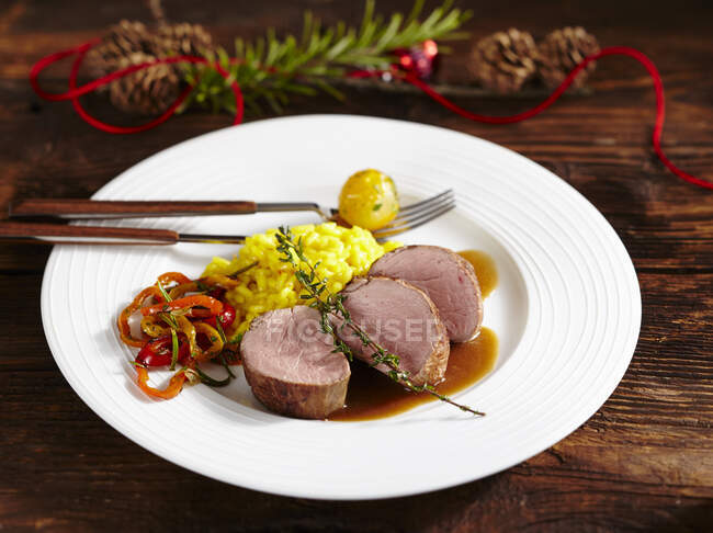 Pork fillet with saffron rice and vegetables — Stock Photo