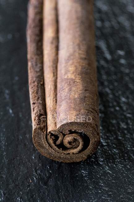 A cinnamon stick (close-up view) — Stock Photo