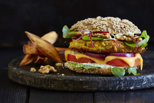 A vegetable burger with walnuts and celery — Stock Photo