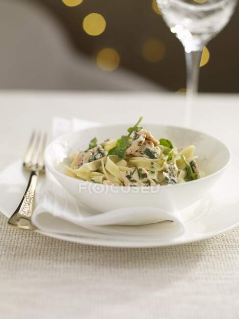Tagliatelle with salmon and rocket for Christmas — Stock Photo