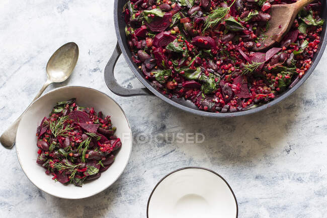 Young beets and beet greens with buckwheat, red beans and dill — Stock Photo