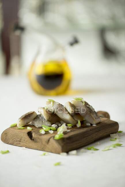 Herring in oil with spring onions — Stock Photo