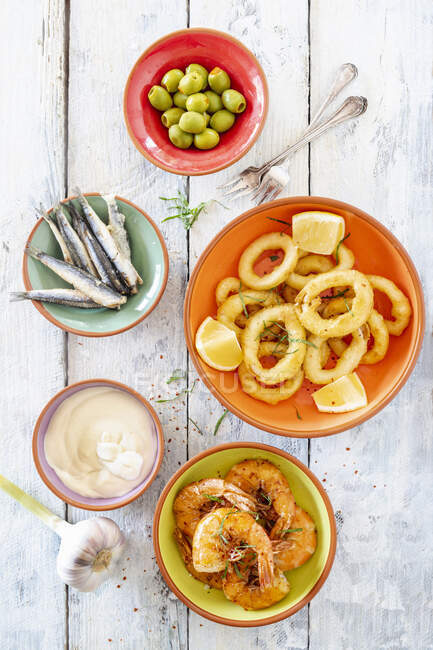 Various tapas with seafood and fish (Spain) — Stock Photo