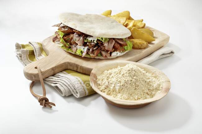 A doner kebab on a chopping board — Stock Photo