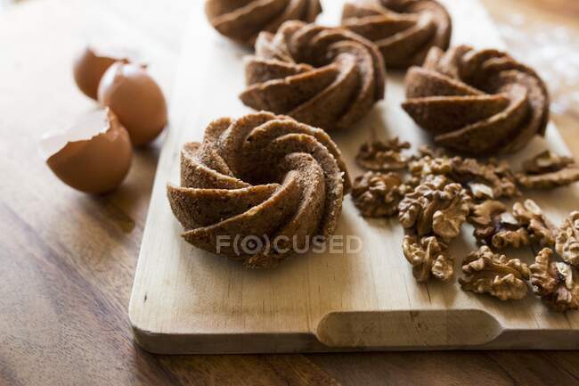 Small walnut gugelhupfs made from a batter — Stock Photo