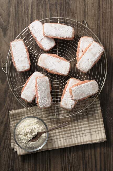 Rose de Reims biscuits on cooling rack — Stock Photo
