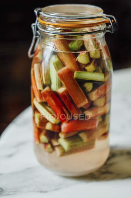 Jar of fresh salad in glass jars on wooden table — Stock Photo