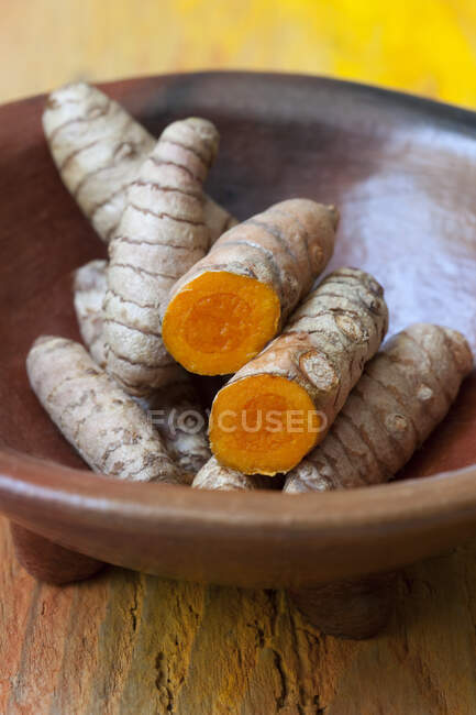 Turmeric root on a wooden background — Stock Photo