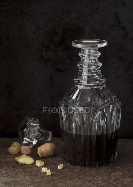 Candied ginger with rum flavouring in a decorative crystal glass jar — Stock Photo