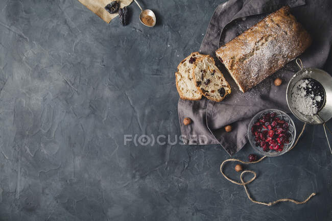 Fruit bread with cranberries and nuts, sliced — Stock Photo