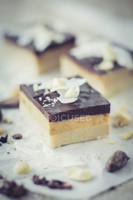 Coconut and caramel cake slices with chocolate — Stock Photo