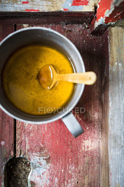 Coriander and ginger tea in a metal cup — Stock Photo