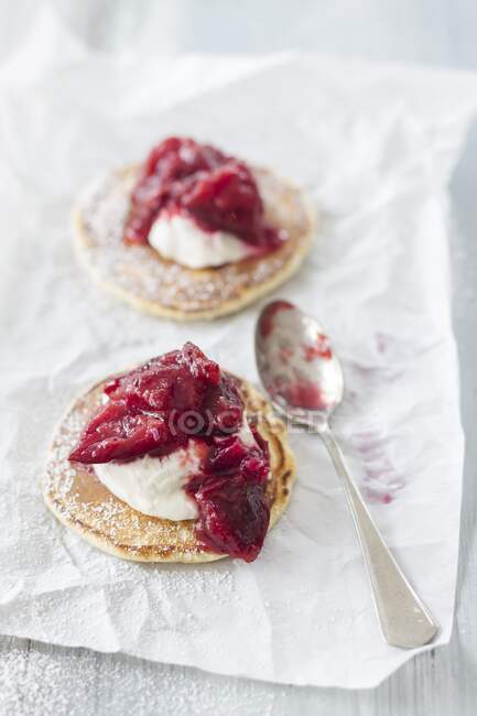 Pancakes with plum compote — Stock Photo
