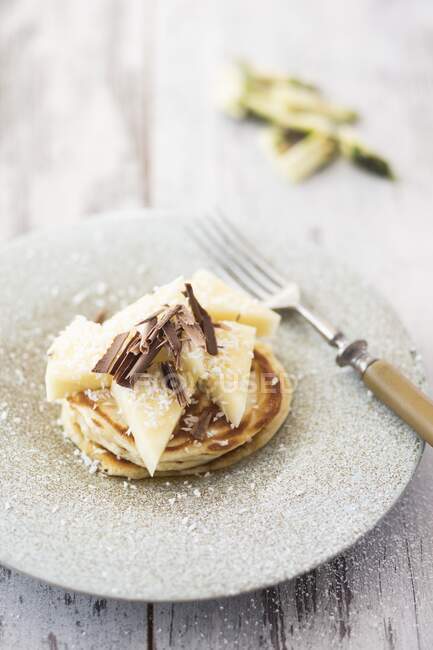 Pancakes with pineapple, coconut and chocolate — Stock Photo
