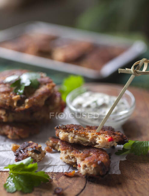 Stacked Salmon Croquettes on Wood Cutting Board with Dill Mayo — Stock Photo