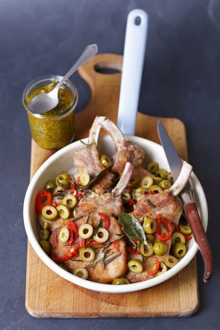 Pork chops with chilli and green olives — Stock Photo