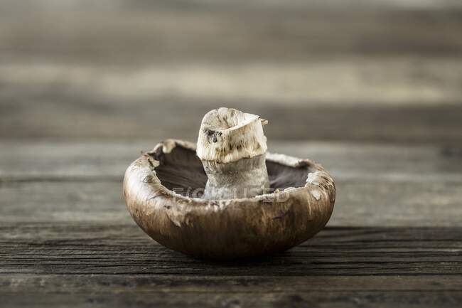 Portobello mushroom on a wooden surface — Stock Photo