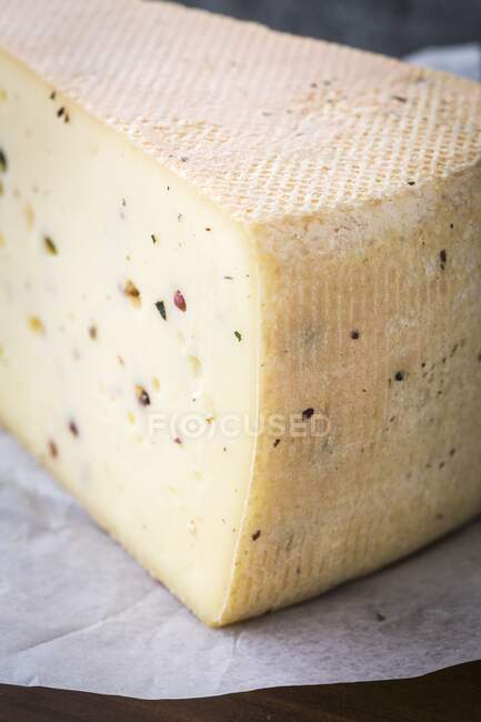 Mountain cheese on paper, close up shot — Stock Photo